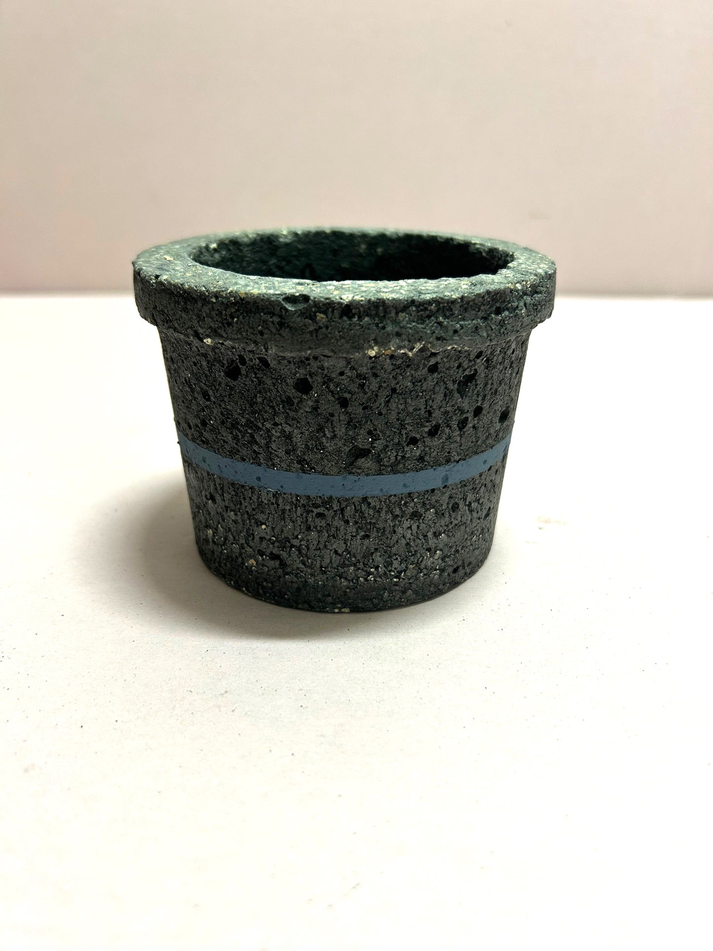 Black small concrete pot with blue stripe