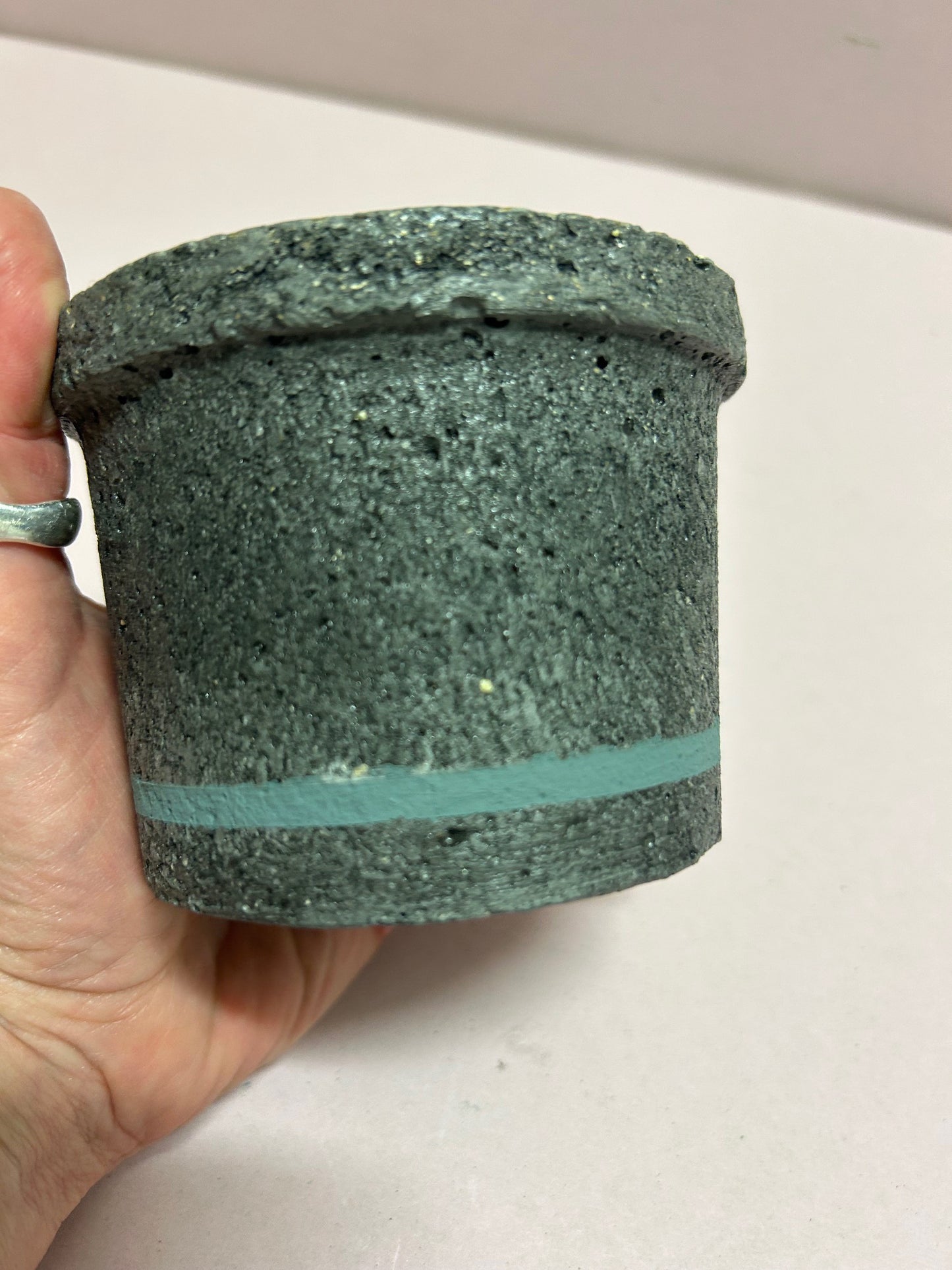 Black small concrete pot with livid coloured stripe