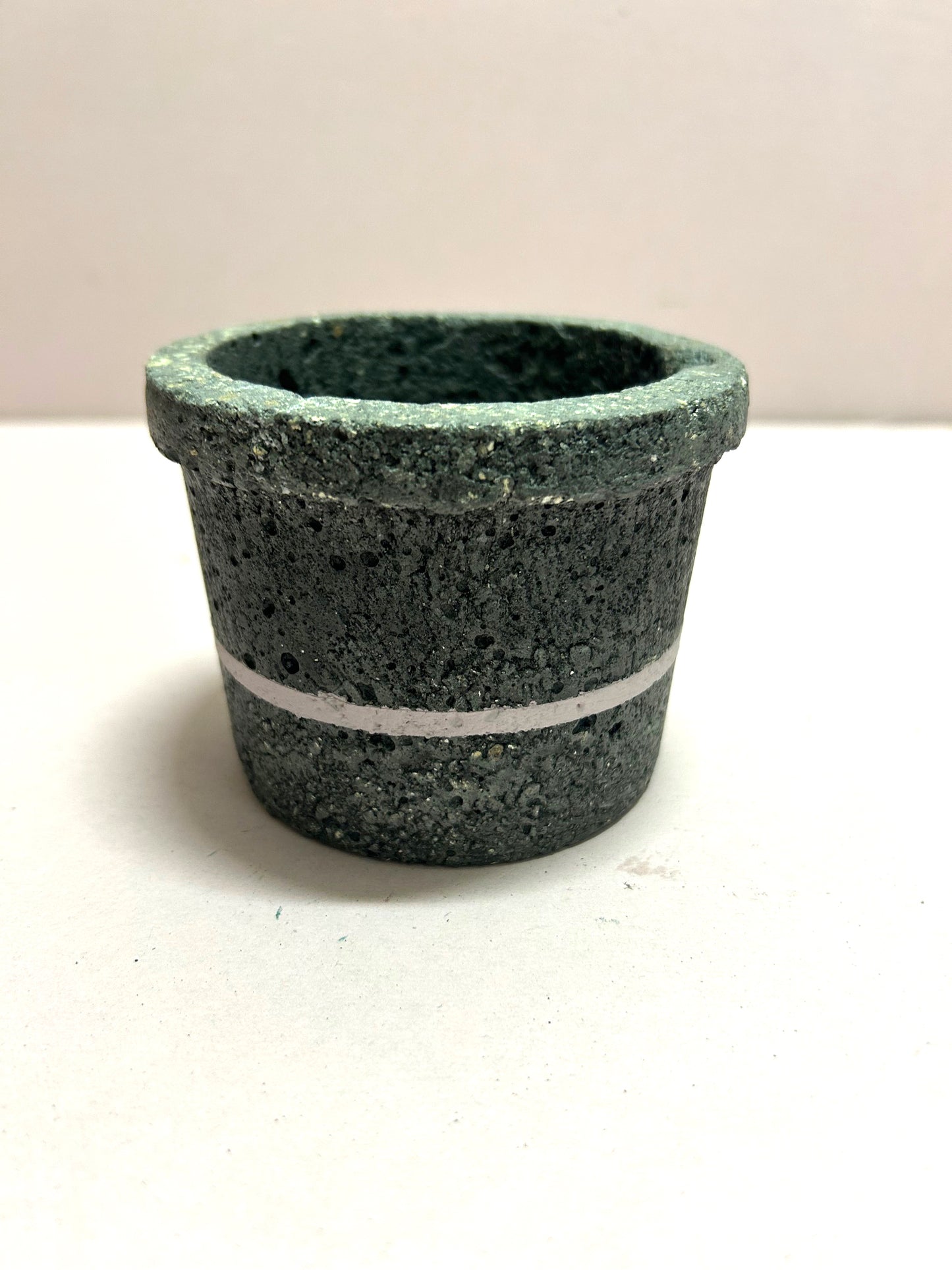 Black small concrete pot with pink stripe
