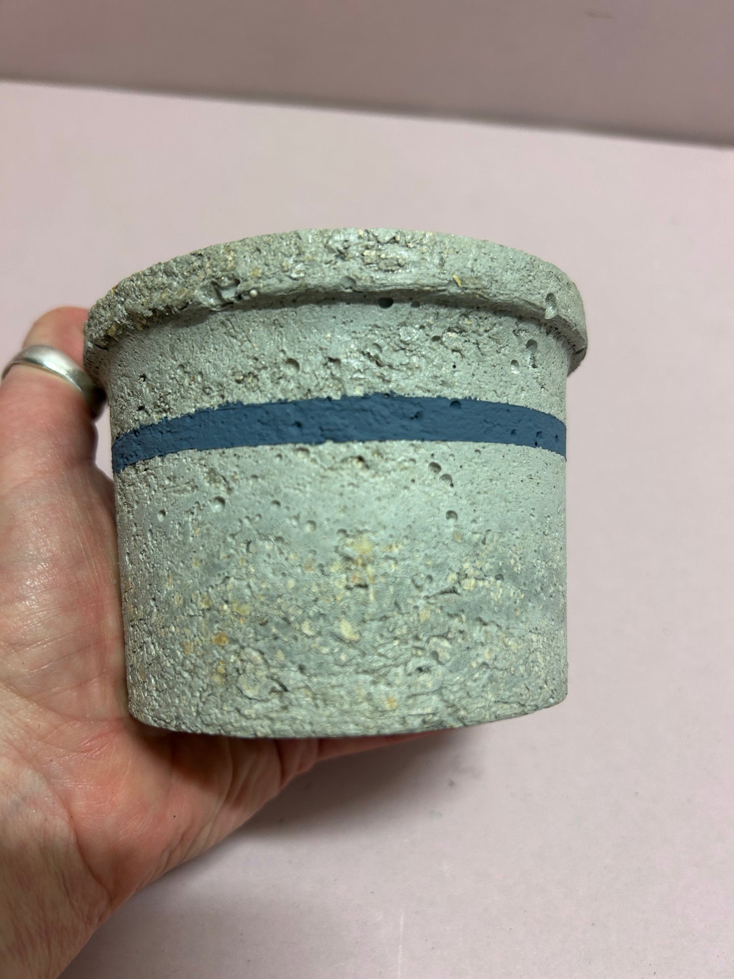 Small natural pot with blue stripe