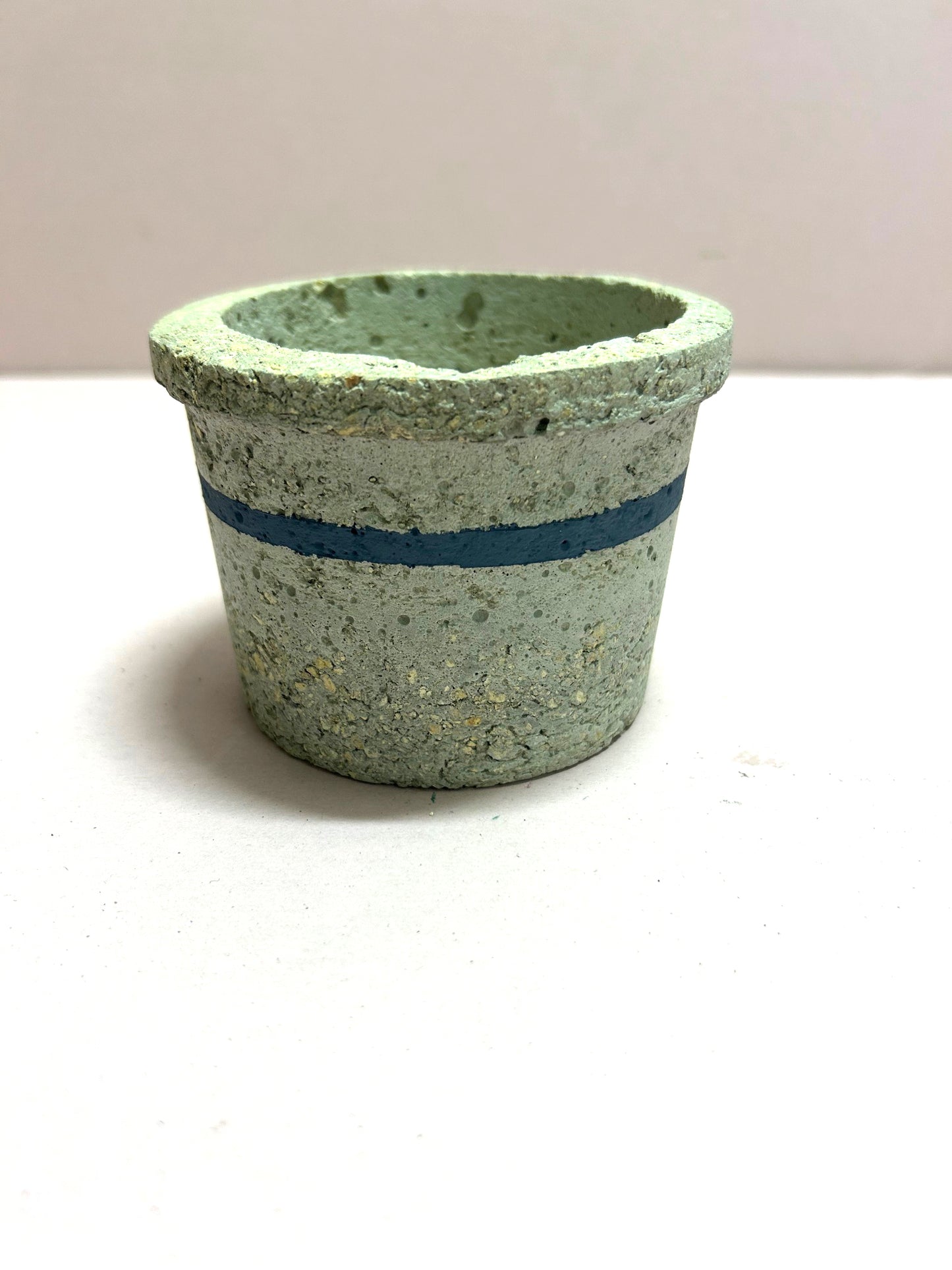 Small natural pot with blue stripe