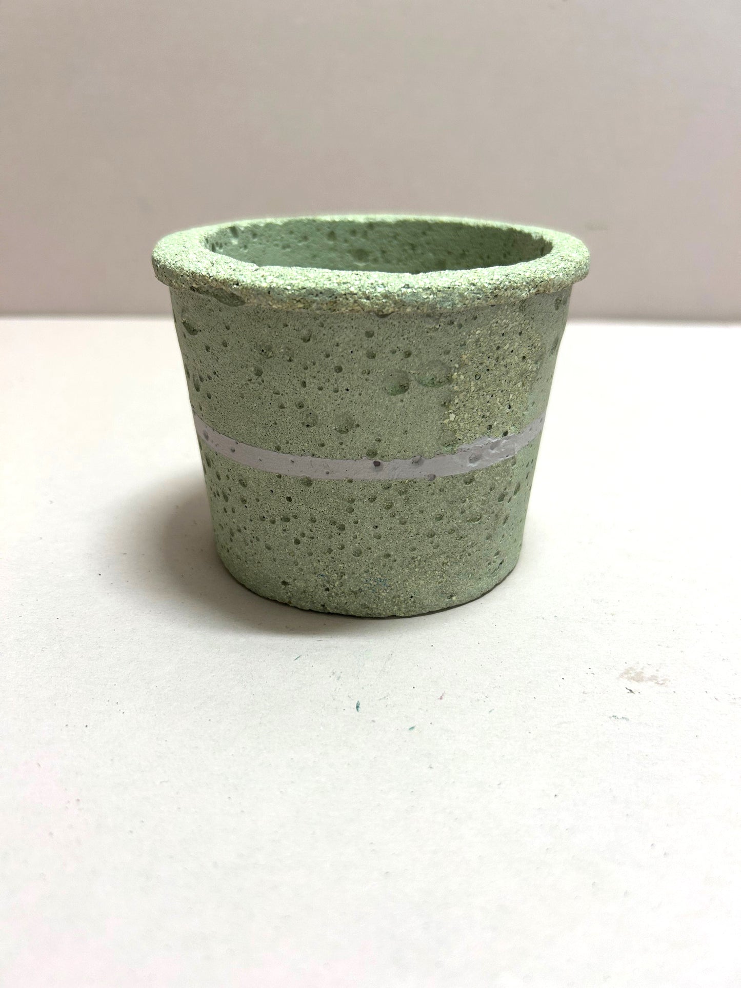 Small natural pot with pink stripe